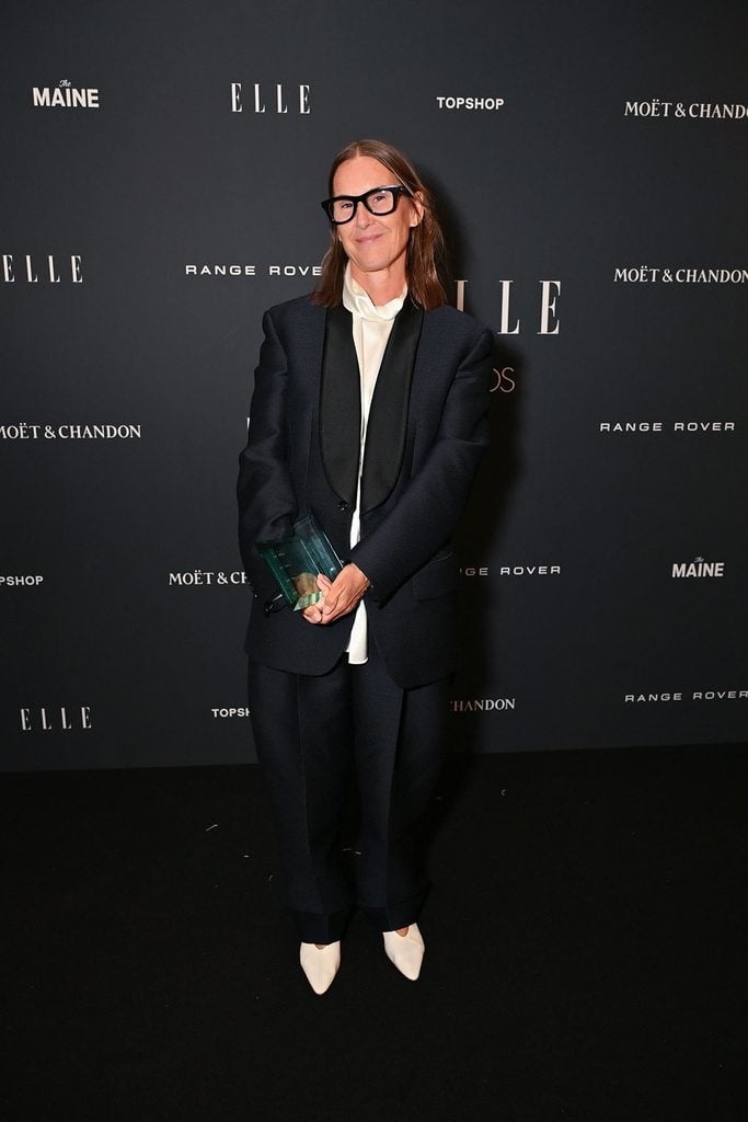 Louise Trotter wearing Bottega Veneta Spring 2026 while holding her Designer of the Year award at the 2026 ELLE Style Awards in London.