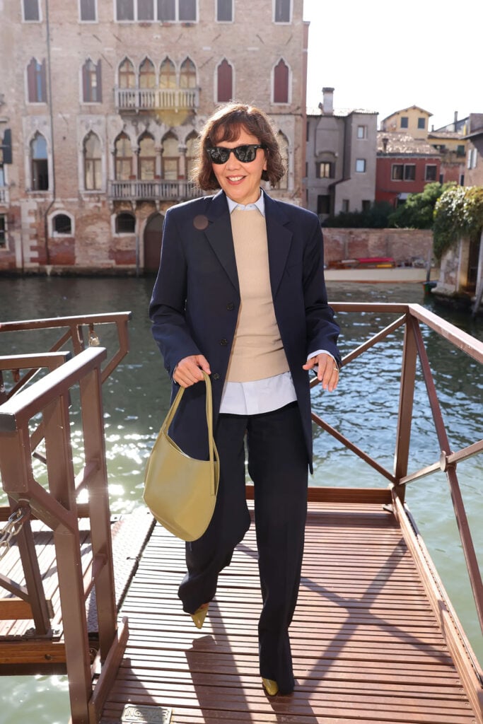 Maggie Gyllenhaal wears Jil Sander by Simone Bellotti while out in Venice during the Venice Film Festival.