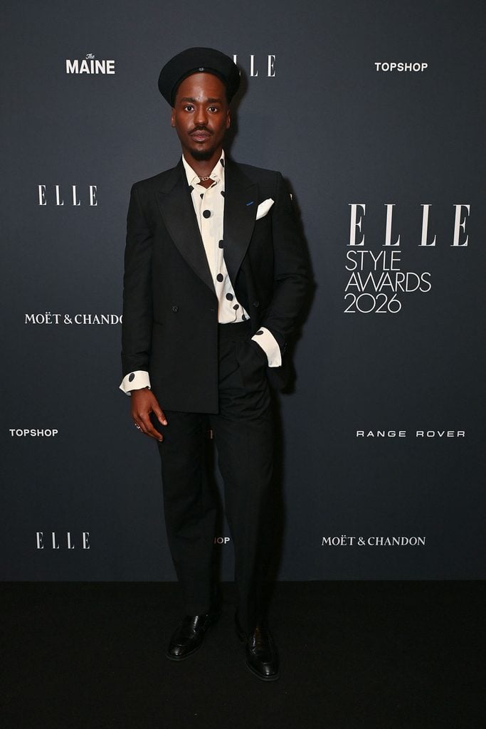 Ncuti Gatwa wearing a Paul Smith suit with a polka-dot shirt and Jimmy Choo loafers while hosting the 2026 ELLE Style Awards in London.