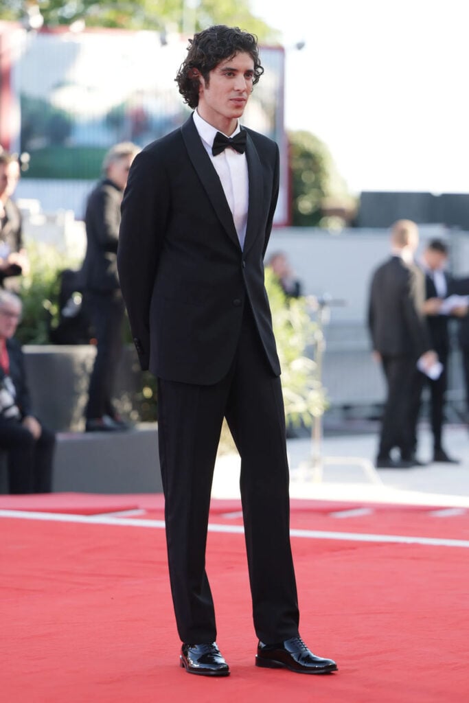 Nicolas Maupas wearing a classic black Giorgio Armani tuxedo at the 2026 Venice Film Festival.