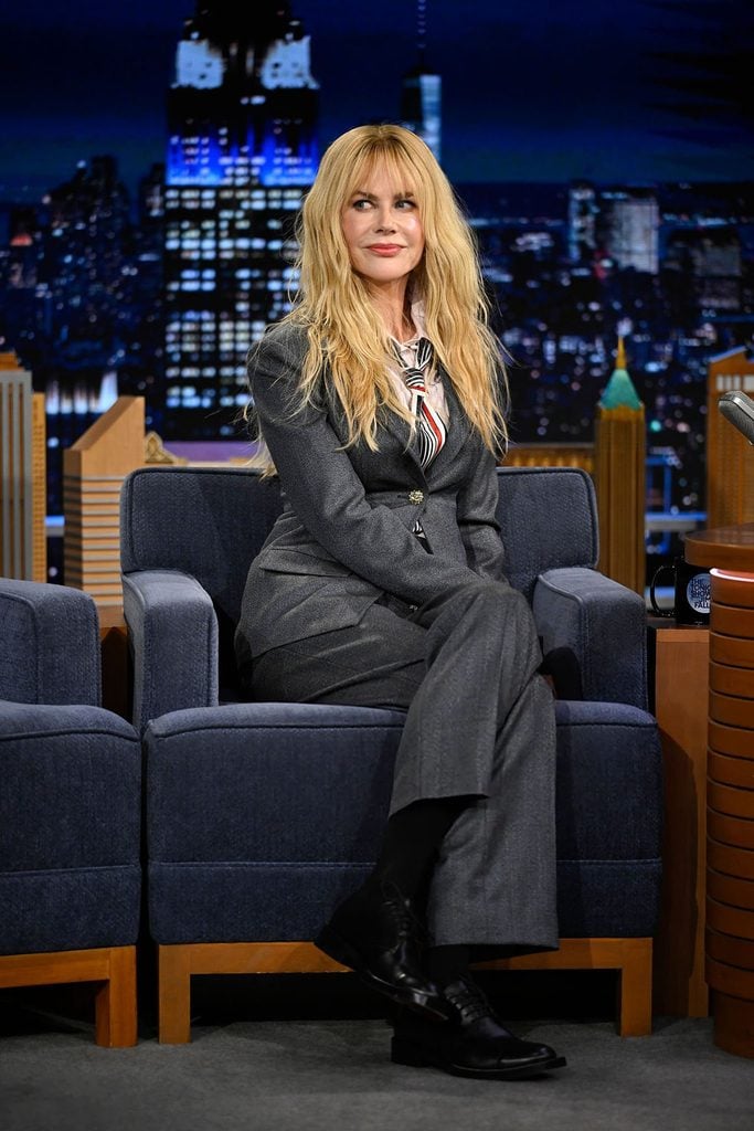 Nicole Kidman in a Chanel Pre-Fall 2026 suit with a pink shirt and striped tie on The Tonight Show Starring Jimmy Fallon