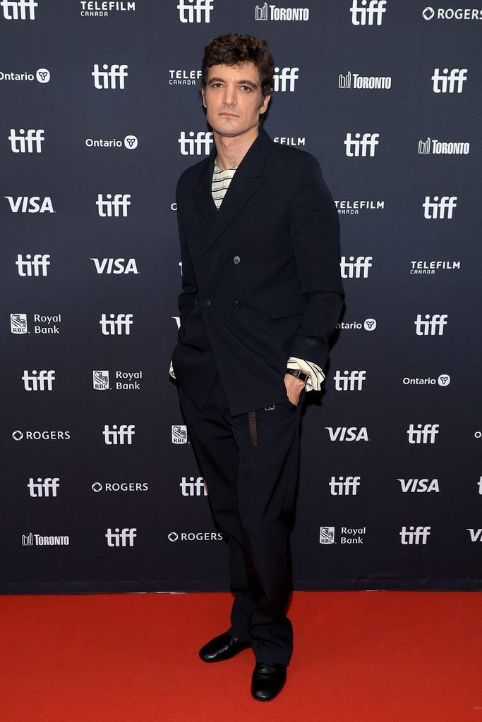 Niels Schneider in Prada at The Unknown premiere during TIFF