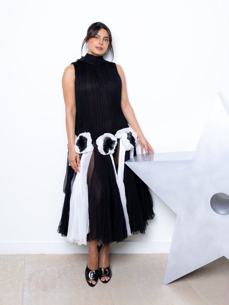 Priyanka Chopra wears a black pleated tulle Dior Resort 2027 dress with white floral appliqués at the 2026 LVMH Prize in Paris.