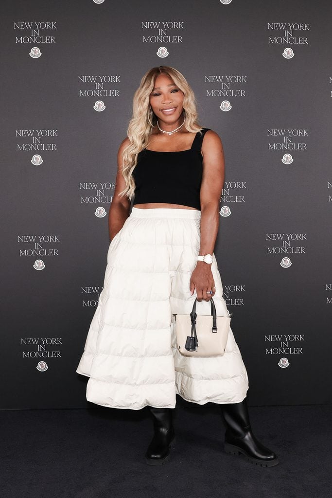 Serena Williams wearing a black crop top and white quilted Moncler maxi skirt at the Fifth Avenue flagship opening in New York.