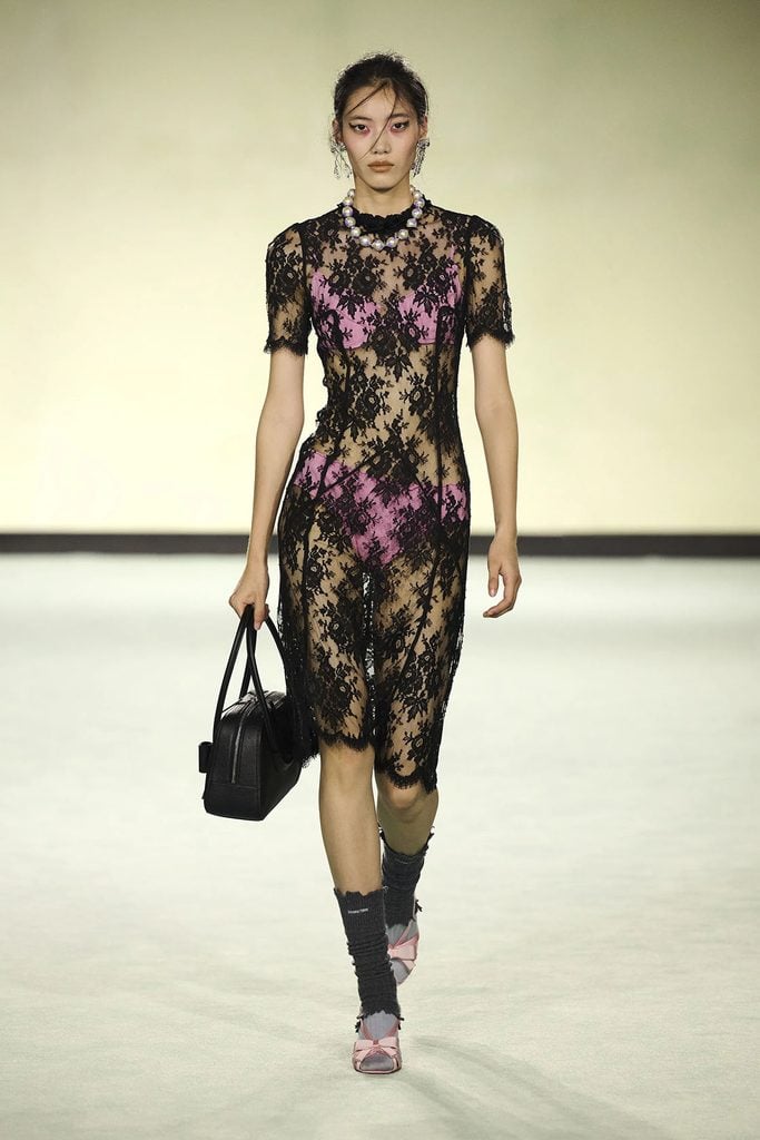 ShuShu/Tong Spring 2026 black lace dress with hot-pink undergarments on the runway.