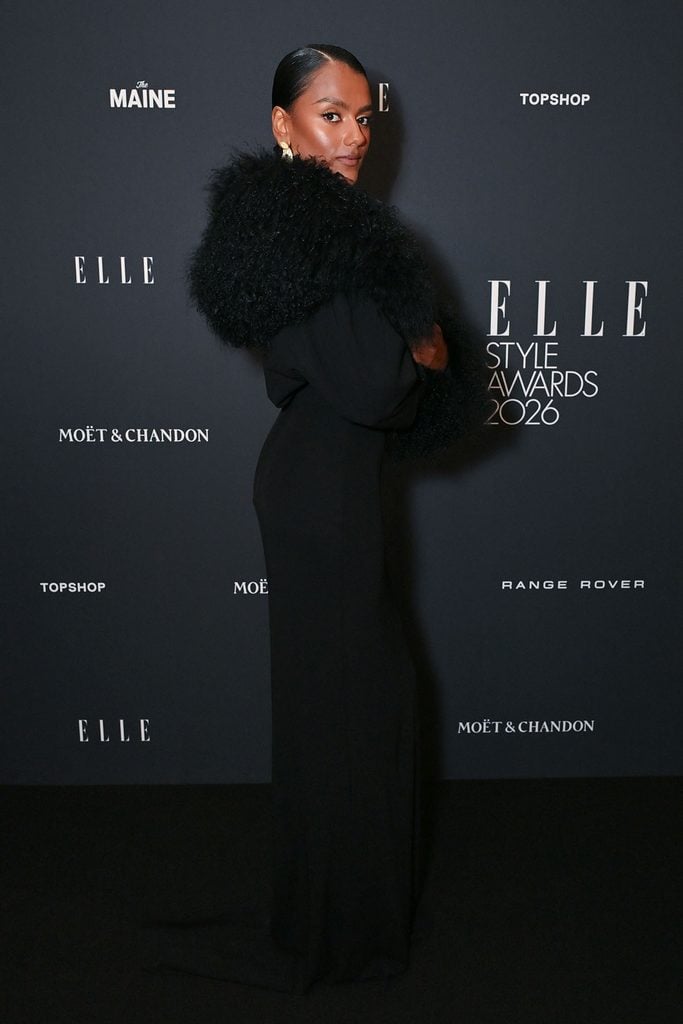 Simone Ashley wearing a black 16Arlington gown with statement shearling sleeves at the 2026 ELLE Style Awards in London.