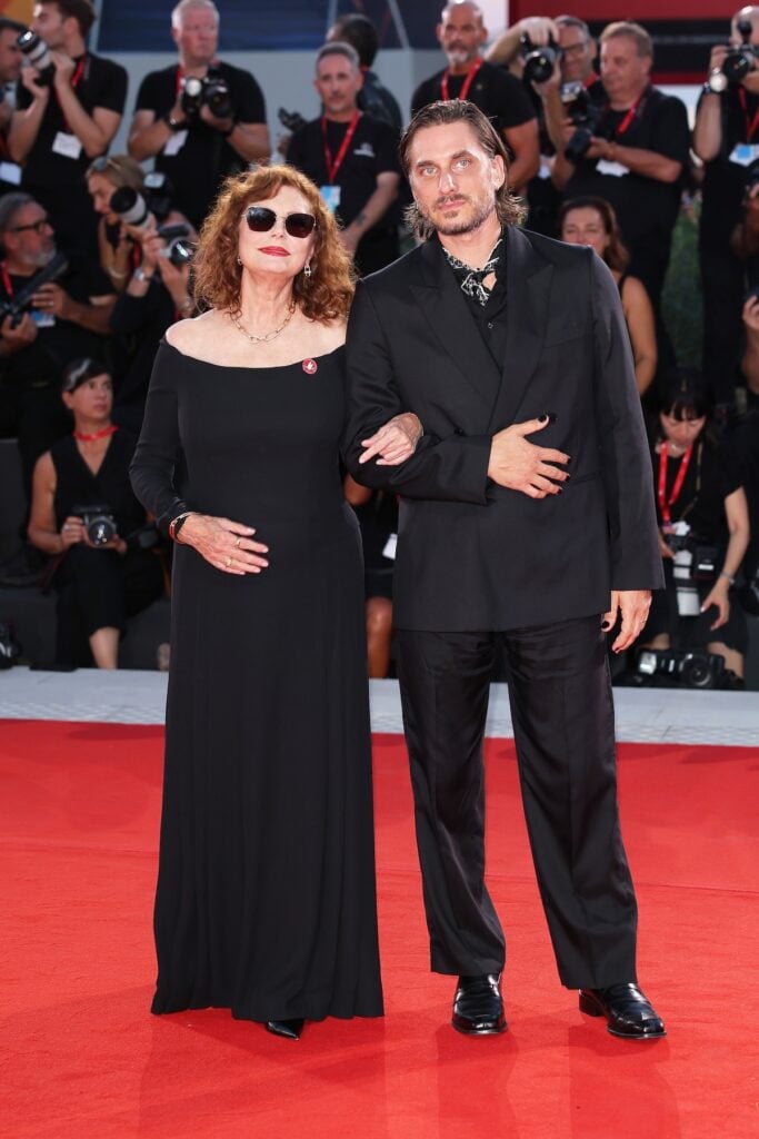 Susan Sarandon and Luca Marinelli wearing Fendi at The Echo Chamber premiere during the 2026 Venice Film Festival.