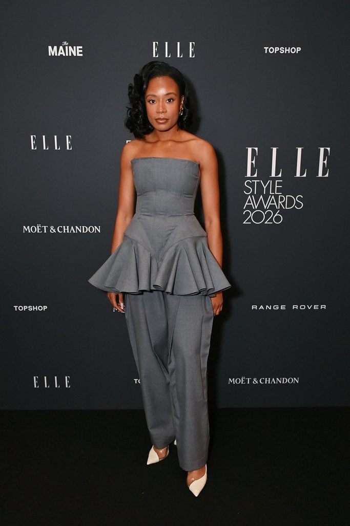 Tolu Coker wearing her own grey strapless peplum design at the 2026 ELLE Style Awards in London.