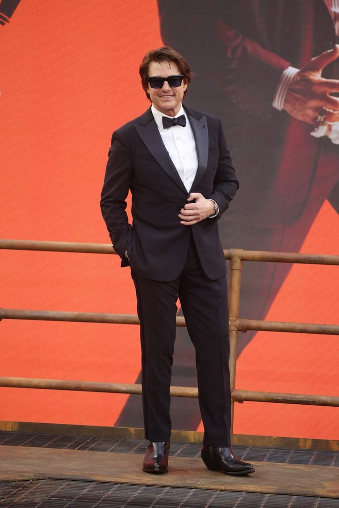 Tom Cruise wearing a midnight-blue Giorgio Armani Made to Measure tuxedo with a white shirt and bow tie at the Digger premiere in London