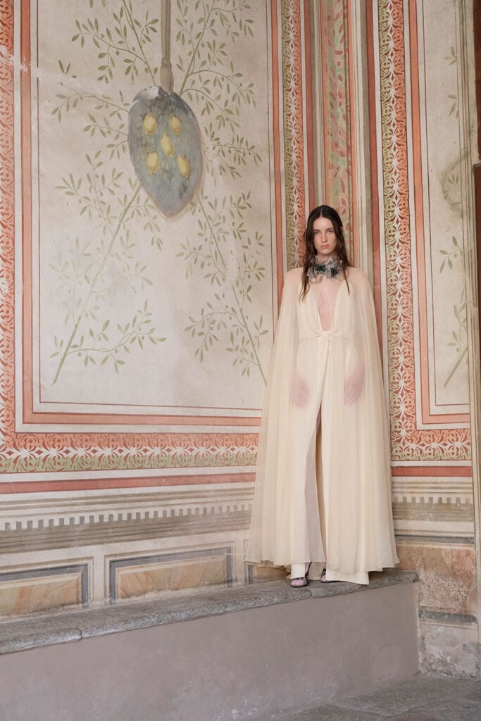 Valentino Resort 2027 pale-pink gown featuring diaphanous fabric and a crystal-and-emerald embellished collar.