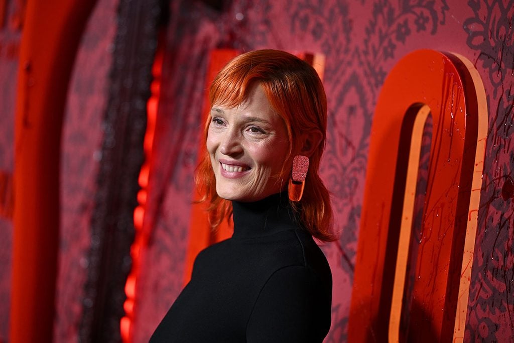 Vicky Krieps wearing statement earrings with her copper-red hair at the Monster: The Lizzie Borden Story premiere