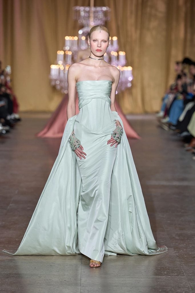 Zuhair Murad Spring 2026 Couture mint-green corseted gown with a sweeping overskirt on the runway.