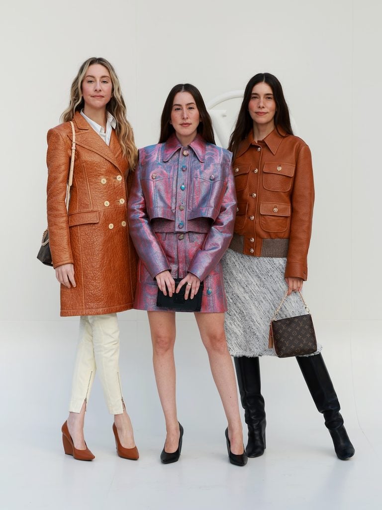 Este, Alana and Danielle Haim wearing Louis Vuitton at the Women’s Spring-Summer 2027 show in Paris.