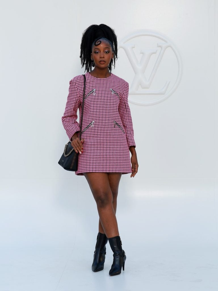 Thuso Mbedu wearing a pink houndstooth Louis Vuitton mini dress at the Women’s Spring-Summer 2027 show in Paris.