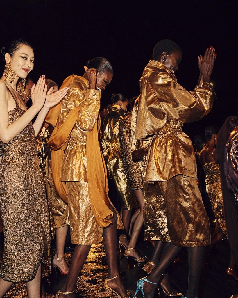 Models wearing gold leather and embellished looks during the Saint Laurent Spring 2027 runway show in Paris.