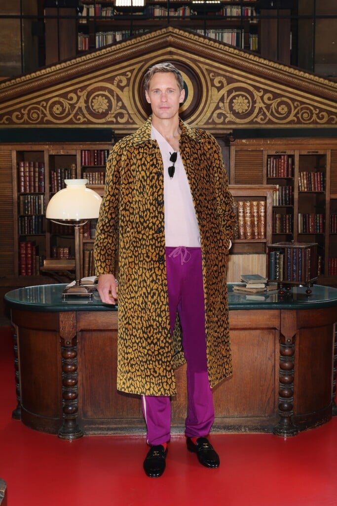Alexander Skarsgård wearing an animal-print Valentino coat at the Valentino Spring 2027 show in Paris.
