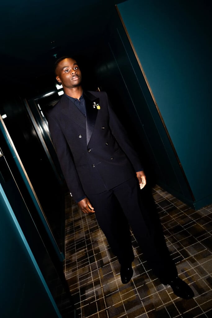 Bukayo Saka in a Wales Bonner Spring 2027 suit with a Compass Brooch at the 2026 Ballon d'Or ceremony.