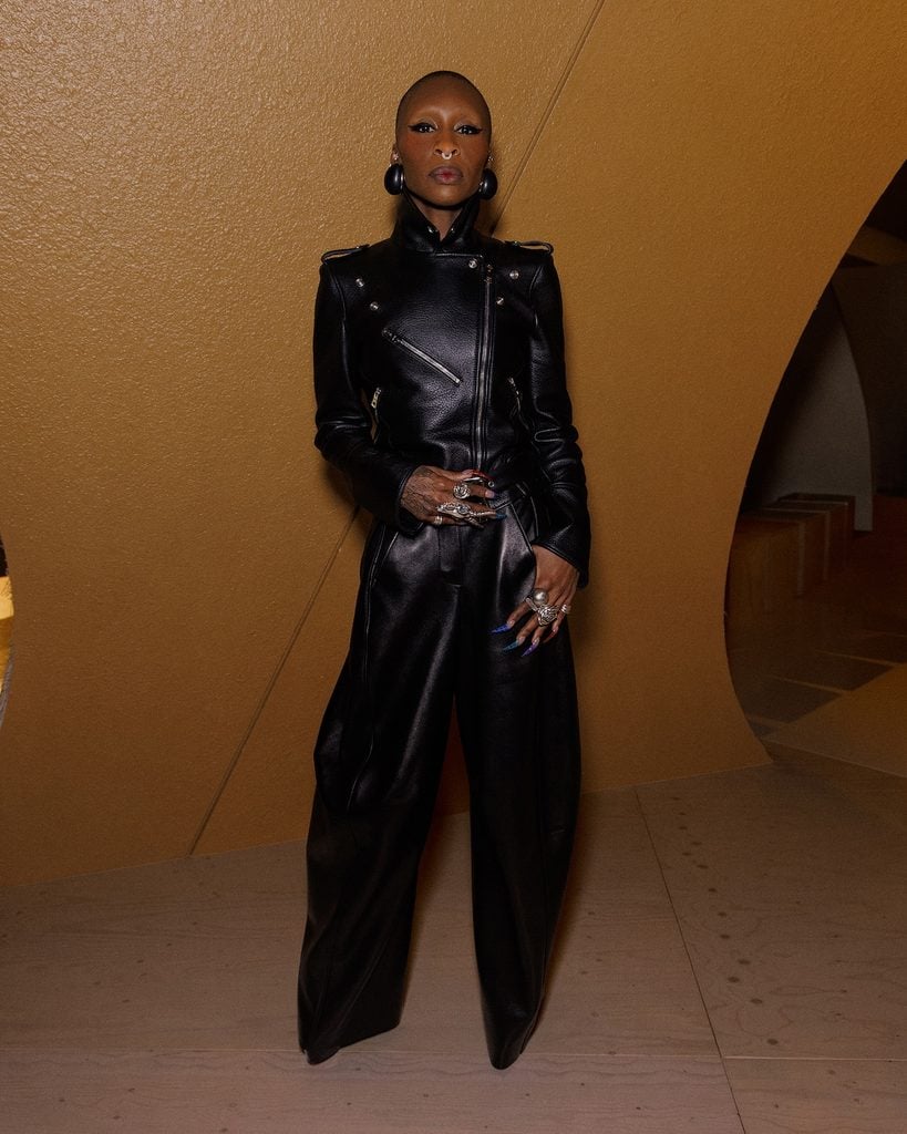 Cynthia Erivo wearing a black leather Givenchy jacket and wide-leg trousers at the Givenchy Spring 2027 show in Paris.