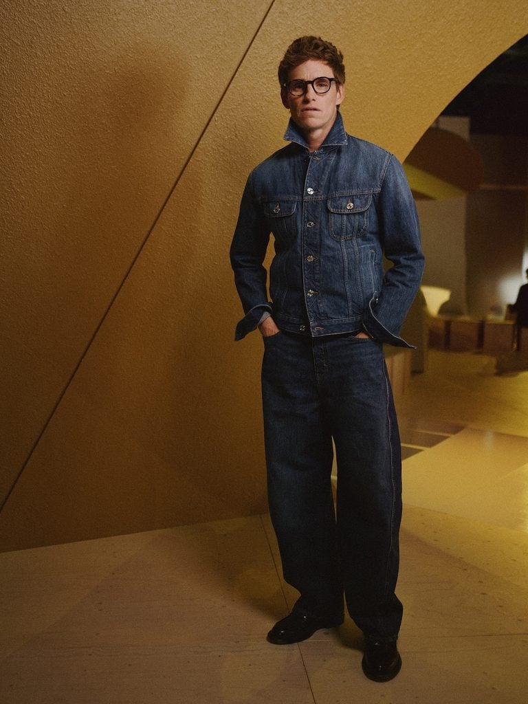 Eddie Redmayne wearing double denim by Givenchy at the Givenchy Spring 2027 show during Paris Fashion Week.