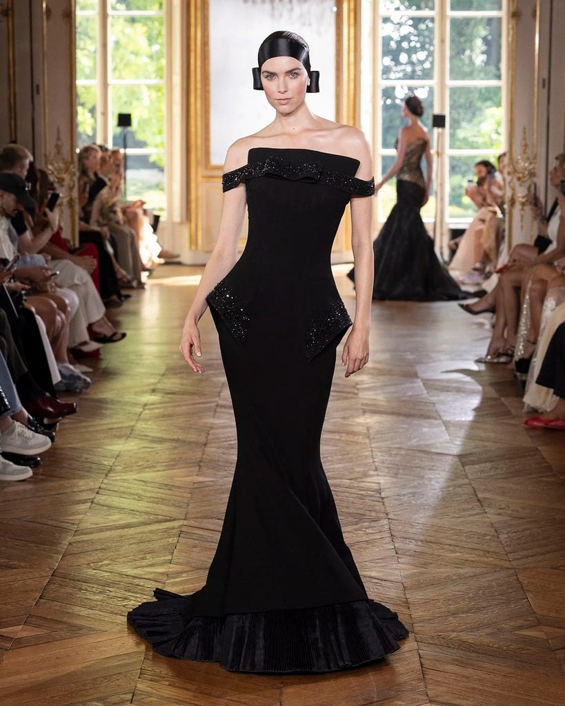 Georges Chakra Fall 2026 Couture runway model wearing the black off-the-shoulder mermaid gown later worn by Eva Longoria