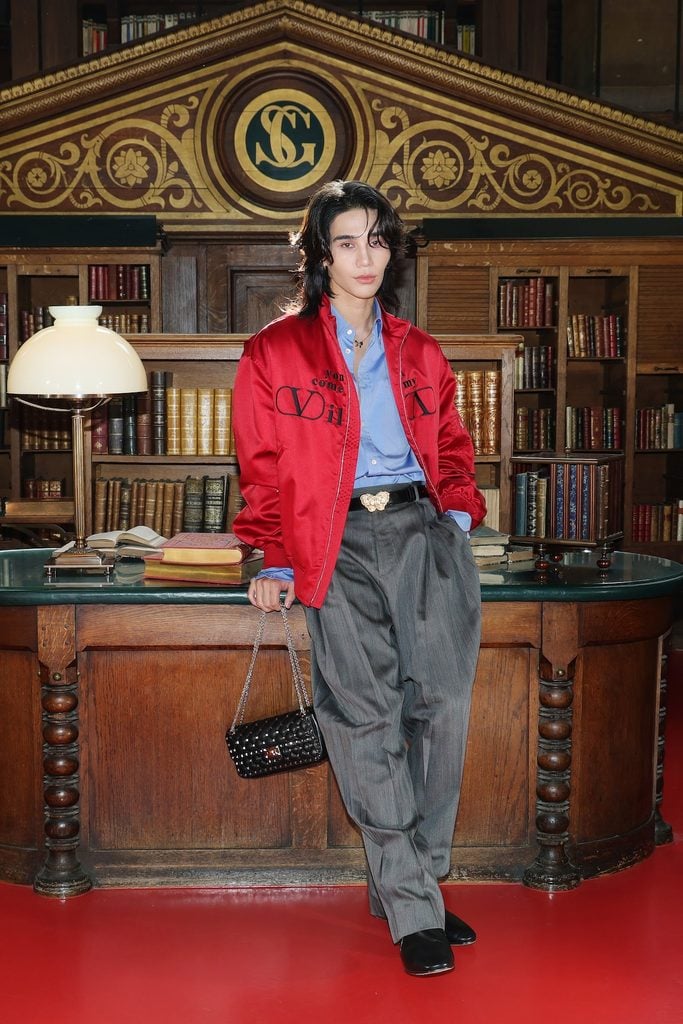 Jeff Satur wearing a red Valentino bomber jacket at the Valentino Spring 2027 show in Paris.