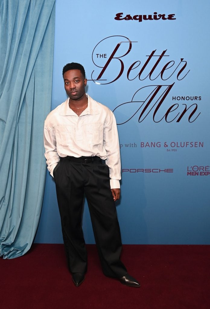 Paapa Essiedu wearing a white Lanvin shirt with utilitarian pockets and high-waisted black trousers at Esquire UK's Better Men Honours in London.