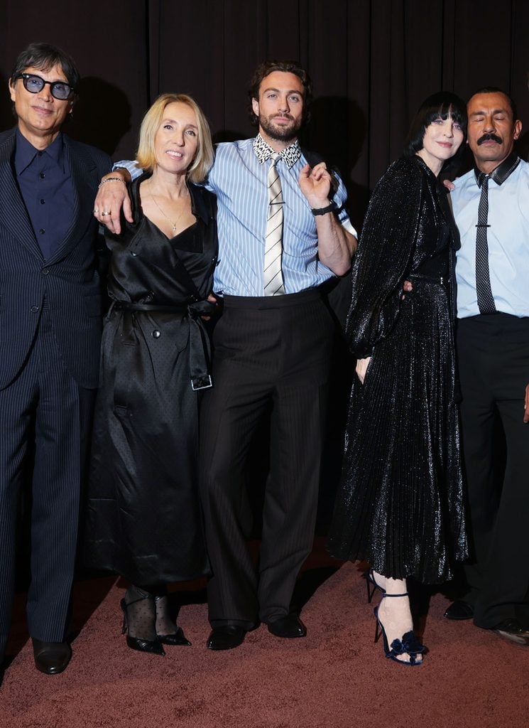 Aaron Taylor-Johnson wears a blue striped Tom Ford shirt with an animal-print collar and black trousers at the 2026 WWD Honors in New York.