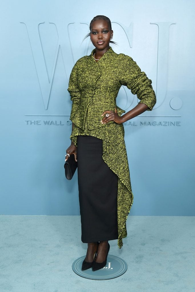 Adut Akech wears a chartreuse Ashlyn Fall 2026 textured jacket with an asymmetric black skirt at the WSJ. Magazine Innovator Awards in New York.