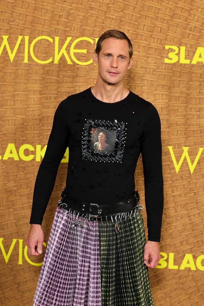 Alexander Skarsgård showing the portrait of Olivia Colman's character on his custom Chopova Lowena beaded jersey top at the 'Wicker' premiere.