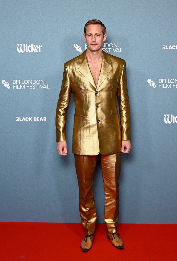 Alexander Skarsgård in a metallic gold Saint Laurent Spring 2027 suit with PVC shoes at the Wicker screening during the BFI London Film Festival.