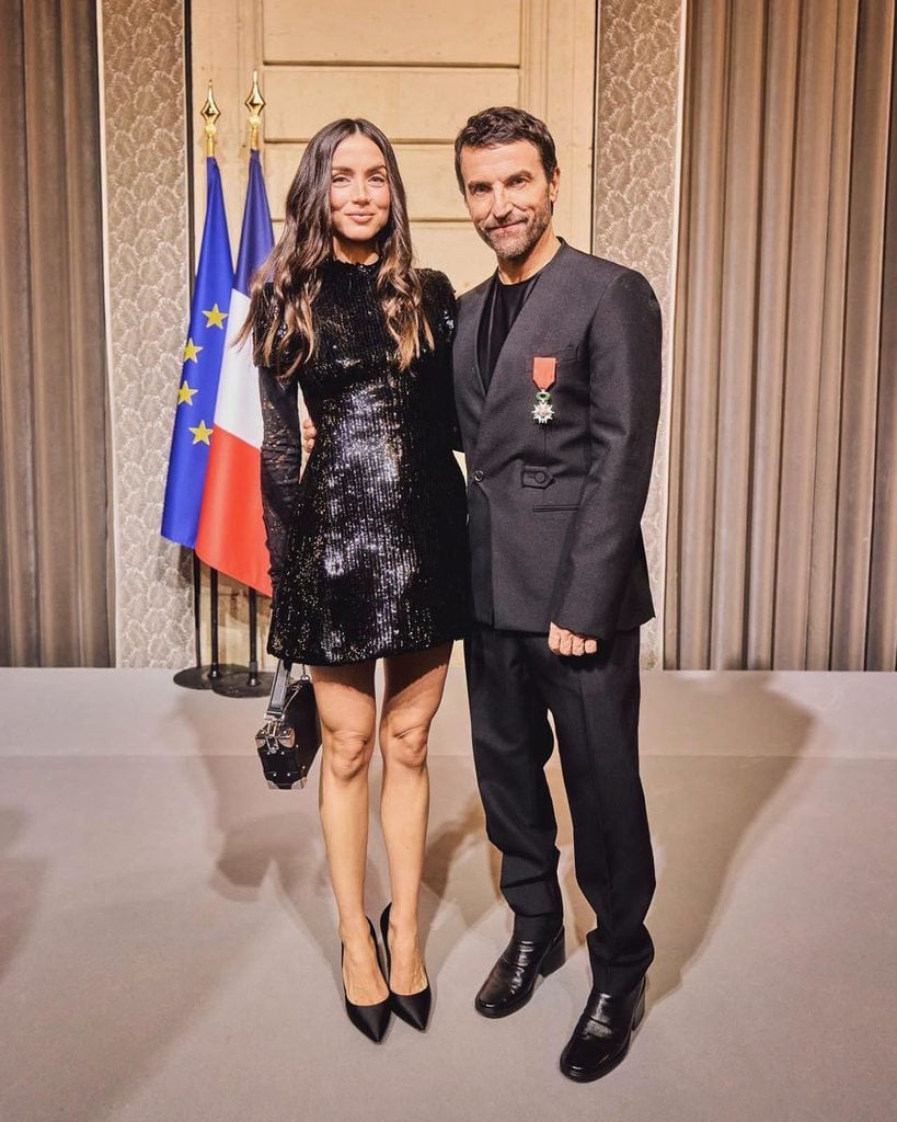 Ana de Armas wearing an archive Louis Vuitton Spring 2015 black sequinned mini dress alongside Nicolas Ghesquière in Paris.