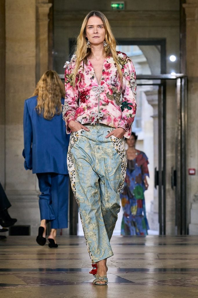 Andreas Kronthaler for Vivienne Westwood Spring 2026 runway look featuring the embellished pink floral jacket later worn by Elle Fanning, styled with contrasting blue printed trousers.