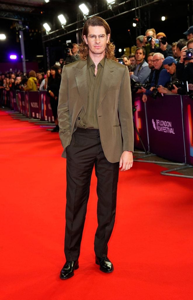 Andrew Garfield wearing a custom olive-green Brioni silk jacket and black trousers at the 'Artificial' premiere during the BFI London Film Festival.