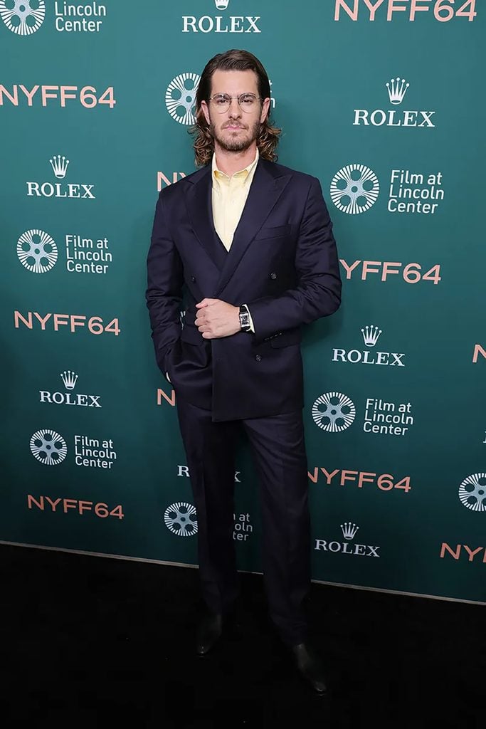 Andrew Garfield wearing a navy J. Press suit with a pale yellow shirt and Jaeger-LeCoultre watch at the 'Artificial' premiere during the 2026 New York Film Festival.