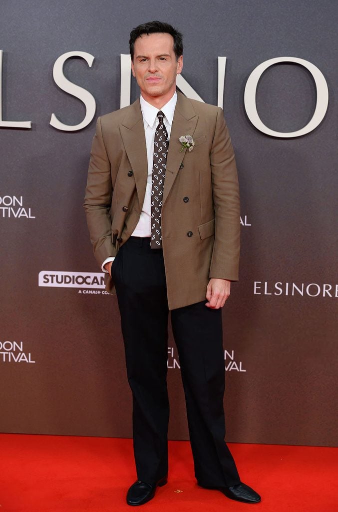 Andrew Scott wearing a brown Celine double-breasted jacket with black trousers and a patterned tie at the 'Elsinore' BFI London Film Festival opening gala.