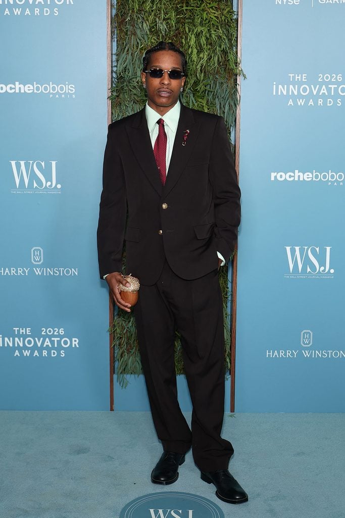 A$AP Rocky wears a brown Chanel suit with an aquamarine shirt, burgundy tie and black shoes at the 2026 WSJ. Magazine Innovator Awards in New York.