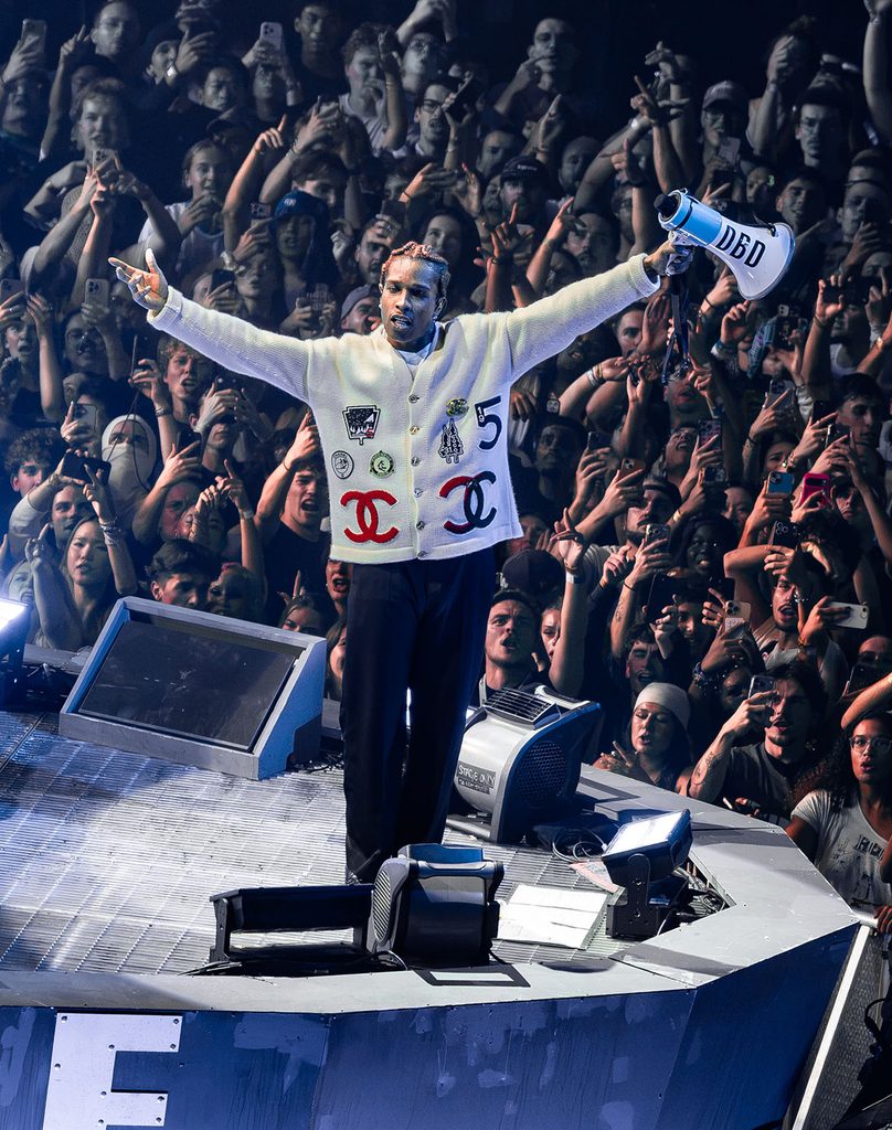 A$AP Rocky wearing a Chanel Coco Neige 2026 cardigan with Chanel trousers during the ‘Don’t Be Dumb’ World Tour.