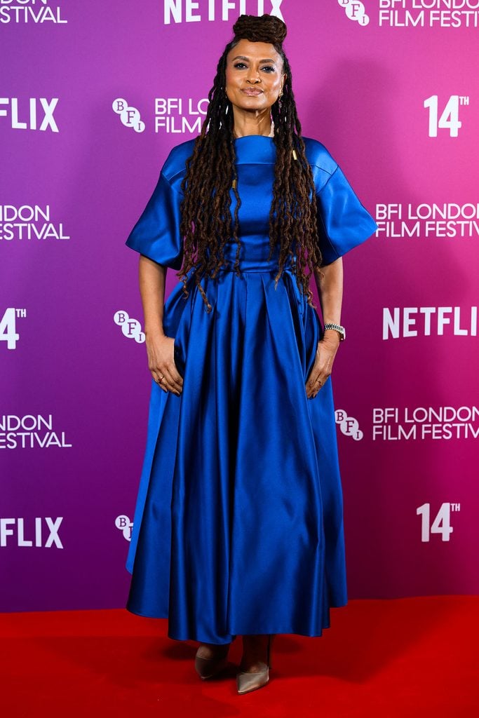 Ava DuVernay in a cobalt blue Prada dress and champagne pumps at the Netflix 14th screening at BFI Southbank in London