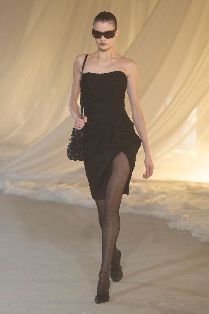 Model wearing the black bustier floral jacquard cloqué midi dress from the Balmain Fall 2026 collection.