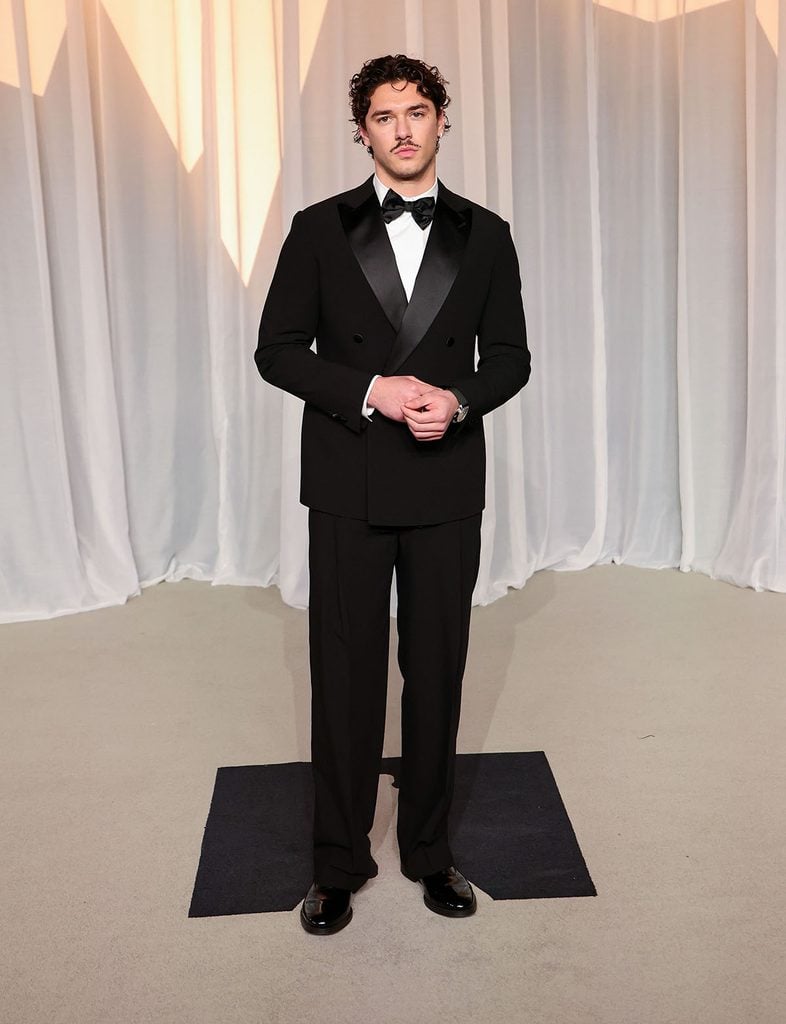 Belmont Cameli wearing a black Giorgio Armani double-breasted tuxedo at the 2026 Academy Museum Gala in Los Angeles