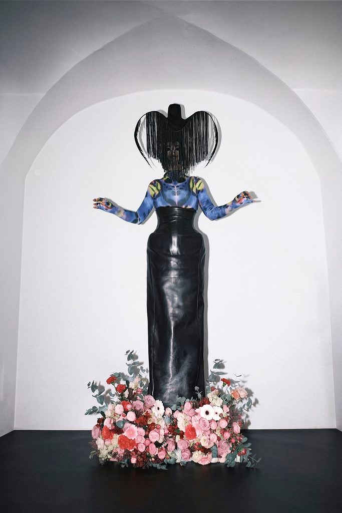 Björk wearing custom Mugler Spring 2027 with a Thierry Mugler Spring 1997 Haute Couture headpiece for her DJ performance in Poland.
