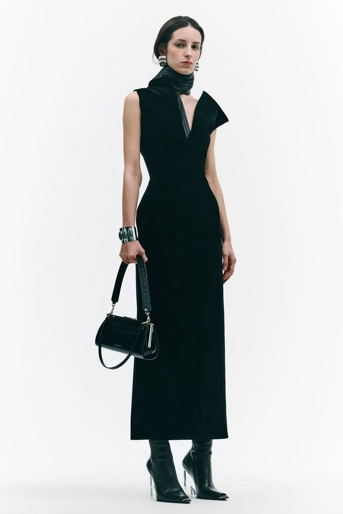 Brandon Maxwell Fall 2026 ready-to-wear Farren black silk-velvet maxi dress, featuring the sculptural neckline seen on Lupita Nyong'o at the WSJ. Magazine Innovator Awards.