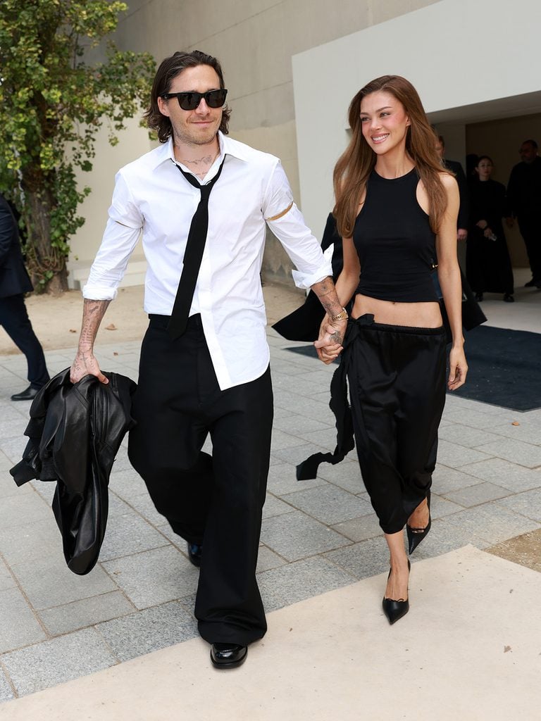 Brooklyn Beckham and Nicola Peltz Beckham wearing Balenciaga at the Spring 2027 show in Paris.