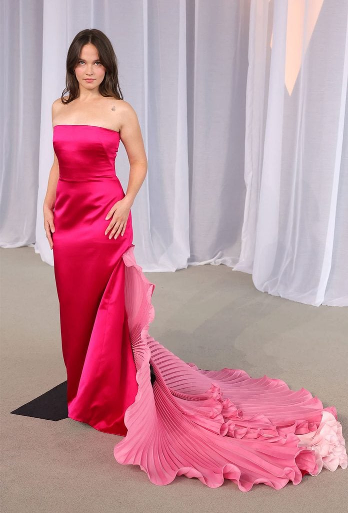 Cailee Spaeny in a fuchsia Valentino Spring 2027 gown with a pleated pink train at the 2026 Academy Museum Gala