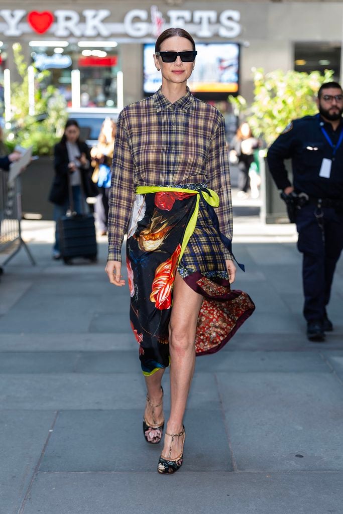 CaitrĂona Balfe wearing a Dries Van Noten plaid shirt, floral wrap skirt and printed Mary Jane pumps in New York.