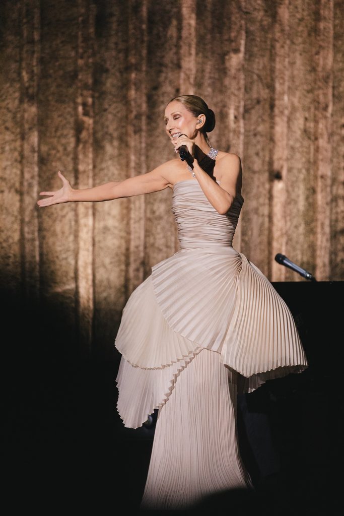 Céline Dion wearing a champagne Dior pleated gown and Bvlgari High Jewellery necklace during her Paris residency on 7 October 2026.