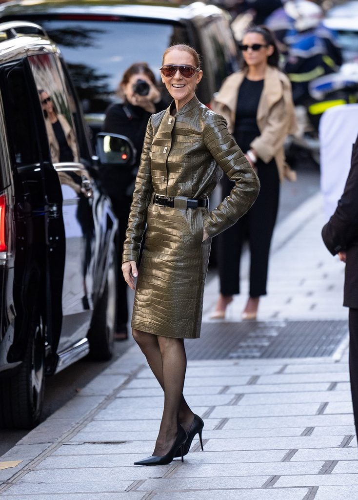 Céline Dion wearing an olive Ferragamo Spring 2027 jacket and matching skirt outside Le Royal Monceau in Paris.