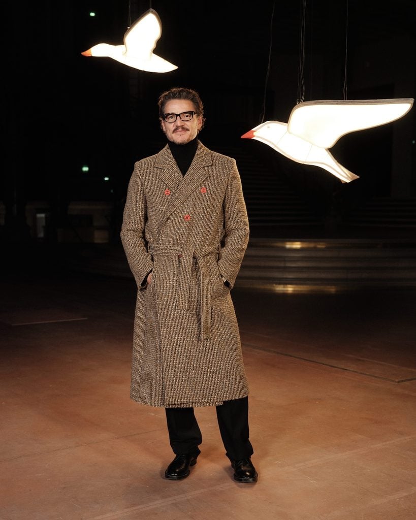 Pedro Pascal wearing a double-breasted Chanel tweed coat at the Chanel Spring 2027 show in Paris.