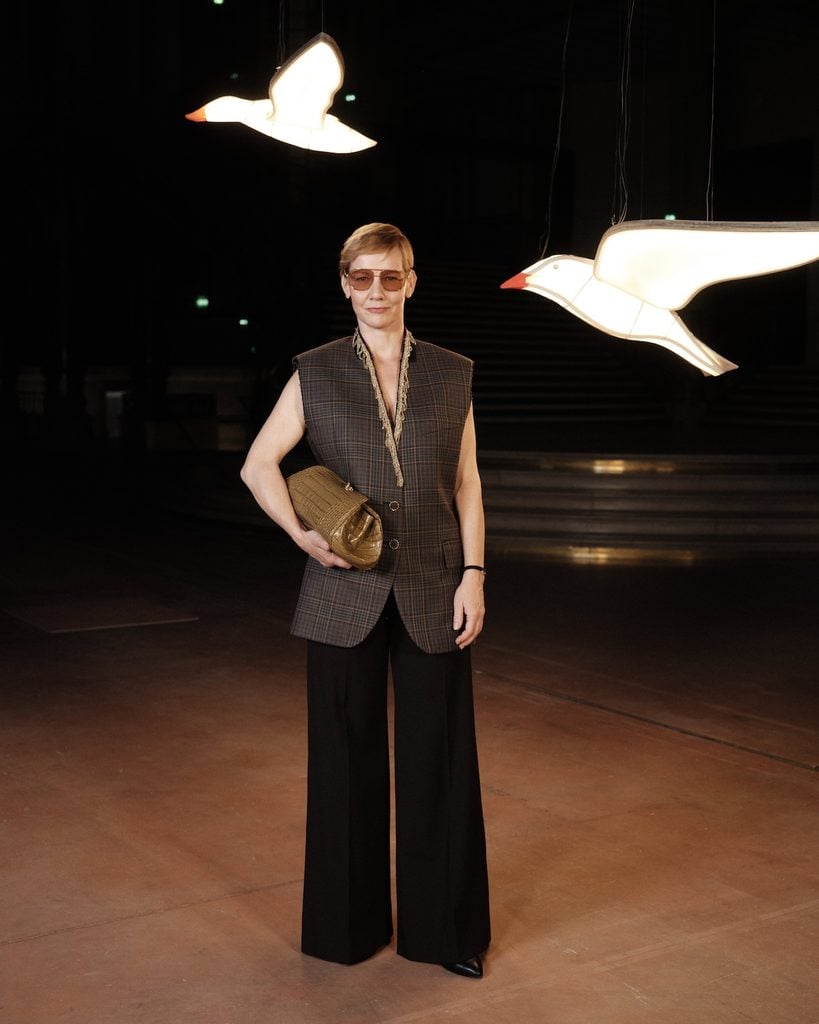 Sandra Hüller wearing a sleeveless Chanel tweed look at the Chanel Spring 2027 show during Paris Fashion Week.
