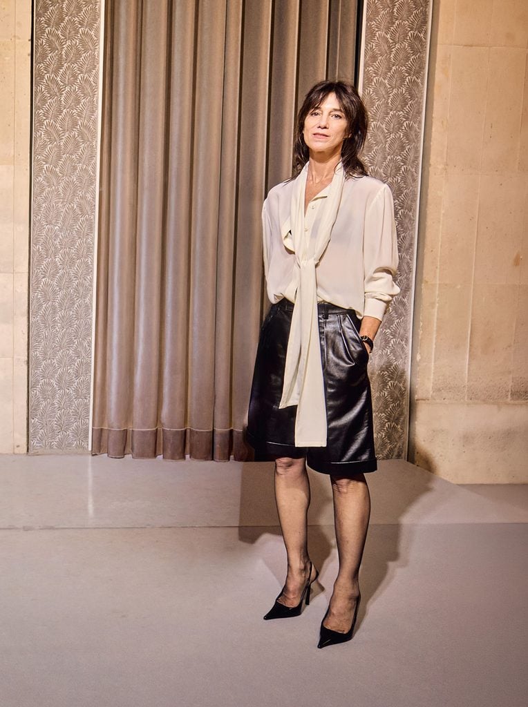Charlotte Gainsbourg wearing a Saint Laurent lavallière blouse and leather shorts with Vendôme slingbacks in Busan.